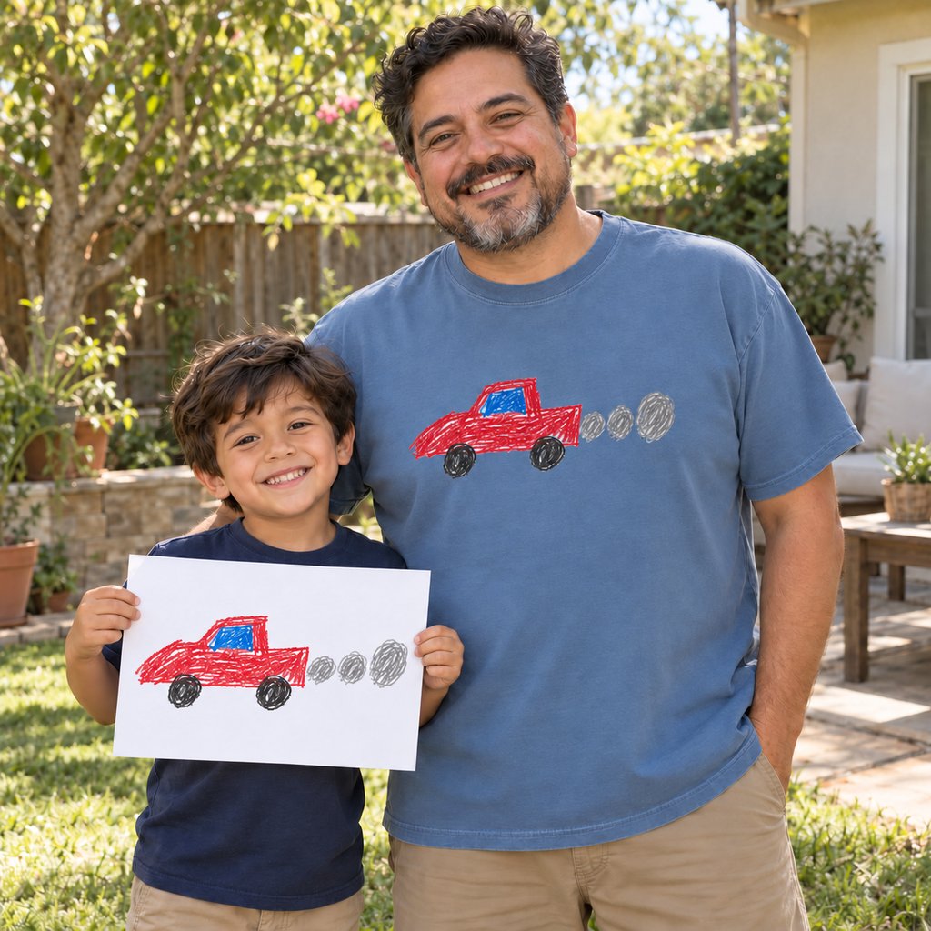Dad in a blue jean premium tee printed with his son's car drawing, next to the paper original
